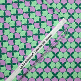 Popeline enduite imprimée pois & trèfle violet fond vert