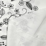 Twill de polyester brodé Solène fond blanc