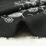Twill of polyester embroidered soil black background