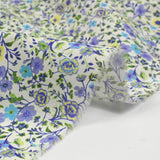 Cotton printed Giorgia purple flowers and blue background ecru per meter