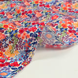 Cotton print Matilde orange and blue flowers per meter
