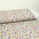 Coton imprimé Anna fleurs violet et jaune fond blanc au mètre