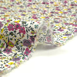 Coton imprimé Anna fleurs violet et jaune fond blanc au mètre