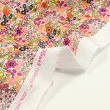 Cotton print Matilde Flowers orange and fuchsia per meter