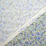 Cotton printed Giorgia purple flowers and blue background ecru per meter
