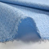 Popeline polycoton imprimée carreaux en pointillisme fond bleu chiné