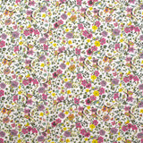 Coton imprimé Anna fleurs violet et jaune fond blanc au mètre