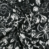 Satin de viscose imprimé fleurs en arabesque fond noir