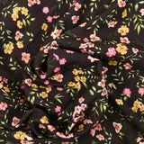 Viscose imprimée fleurs fuchsia et ocre fond marron