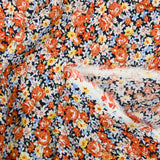 Viscose imprimée fleurs caramel fond marine