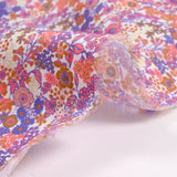 Cotton print Matilde Flowers Coral and Lavender per meter