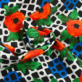 Sergé de coton et viscose coquelicot et mosaïque fond blanc cassé