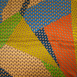 Satén de seda estampado paisley patchwork naranja, mostaza y azul