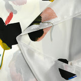 Silk satin printed with stylized flowers off-white background