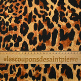 Satin polyester imprimé léopard fond doré