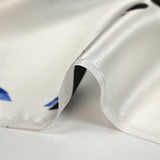 Silk satin printed with stylized flowers off-white background