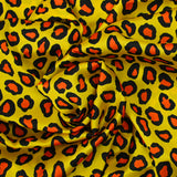 Satin polyester imprimé léopard fond jaune