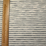 Jersey de coton piqué rayé fond écru