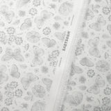 Piqué de coton imprimé papillons et fleurs fond blanc