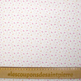 Piqué de coton imprimé fleurs et coeurs rose et orange fond blanc