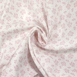 Piqué de coton imprimé brindille dans le vent vieux rose fond blanc