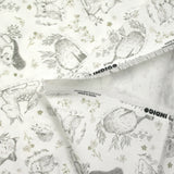 Piqué de coton imprimé les animaux de la forêt vert fond blanc