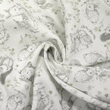 Piqué de coton imprimé les animaux de la forêt vert fond blanc