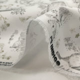 Piqué de coton imprimé les animaux de la forêt vert fond blanc