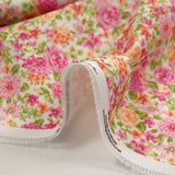 Piqué de coton imprimé les fleurs de Sarah rose et orange fond blanc