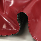 Faux leather with vinyl effect with raspberry red Prince of Wales side