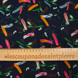 Gold striped muslin printed with fireworks on a navy background