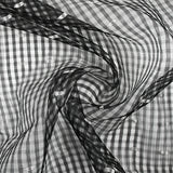 Organza de 100% soie ajouré plumetis fond noir