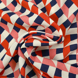 Crêpe viscose imprimé géométrie variable corail et marine fond écru