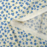 Crêpe viscose imprimé fleurs bleues fond écru