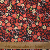 Crêpe polyester imprimé fleurs corail fond marron