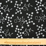 Twill de polyester brodé marguerite fond noir
