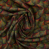 Viscosa estampada pavo real sobre fondo negro punteado rojo, amarillo y verde