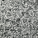 Viscosa estampada con graffitis negros sobre fondo blanco