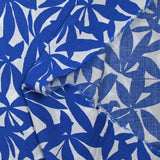 Viscose printed with blue bamboo leaves on white background