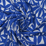 Viscose printed with blue bamboo leaves on white background