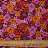 Viscose printed sixties flowers in red, plum and orchid