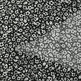 Viscose printed with myriad gray and white flowers on a black background
