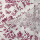 Viscose printed with purple flowers and butterflies on a white background