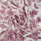 Viscose printed with purple flowers and butterflies on a white background