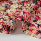 Viscose printed with raspberry heather and yellow black background