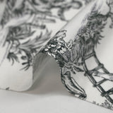 Viscose printed with black toile de Jouy on an off-white background