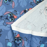 Coton imprimé Stitch fond bleu barbeau