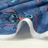 Coton imprimé Stitch fond bleu barbeau