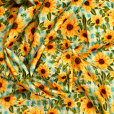 Coton imprimé tournesol fond vichy bleu