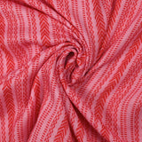 Voile de viscose et laine imprimé aztèque rouge fond rose